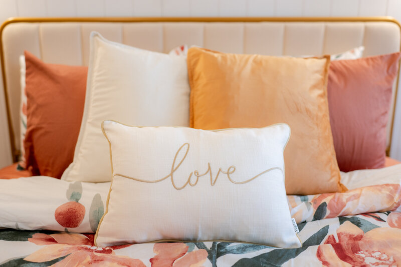 Gold and coral bedding in bridal suite at The Era Brdal Suite Wedding Venue