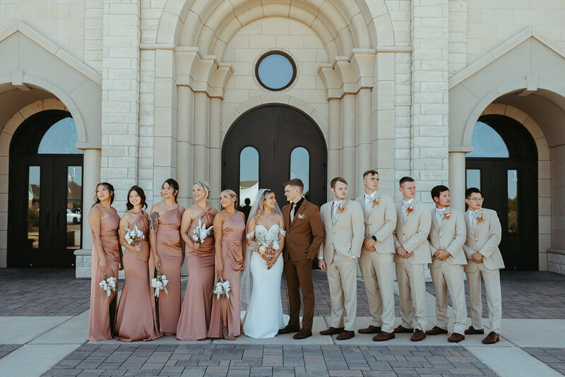 wedding party celebrates with bride and groom with ashley cole photography