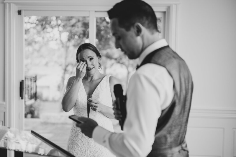 A bride wipes a tear away during speeches at Elle by Stella in St.Jacobs, Ontario.