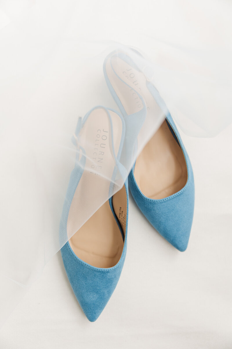 a pair of blue bridal shoes