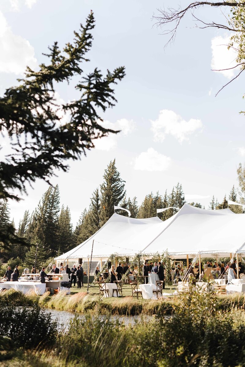 jackson-hole-wyoming-wedding-photography-ceremony-bride-groom-walking-tent