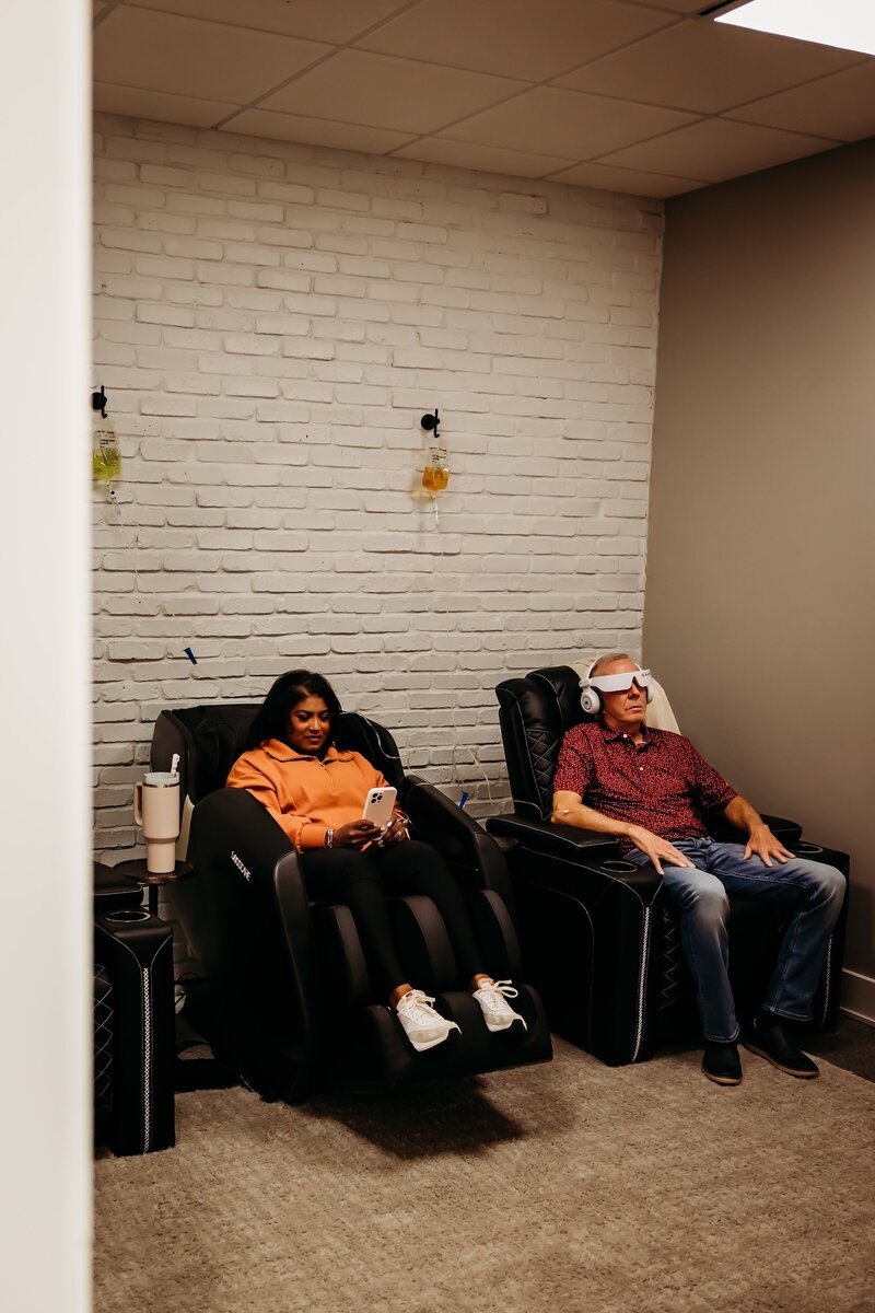 Man with brain tap device sitting in lounge
