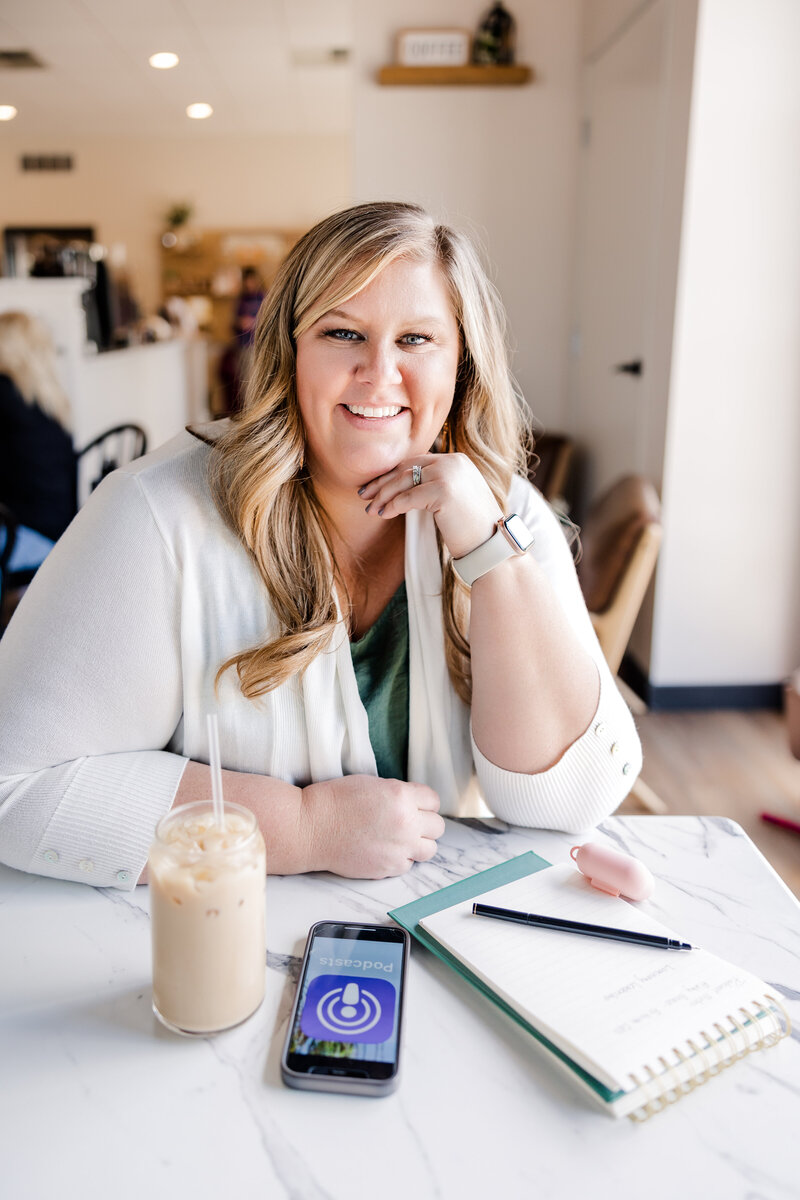 A candid shot of Meg Williamson smiling warmly as she mentors a business owner. The image captures her friendly and approachable nature, reflecting her passion and dedication to her craft.