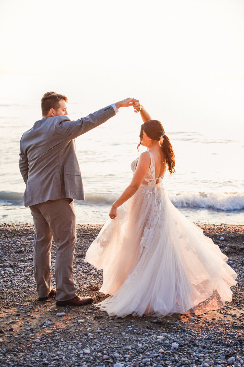bride and groom wedding photos on lake huron at sunset