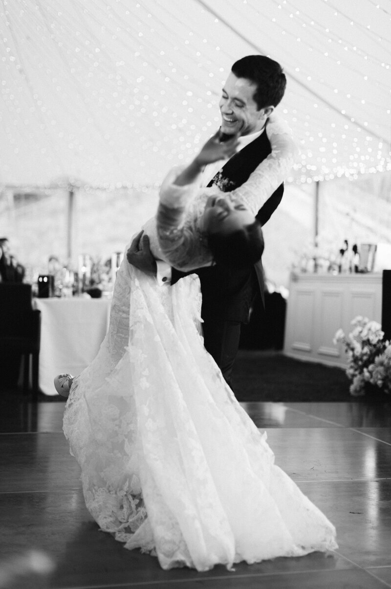 Bride and Groom dancing and enjoying together black and white