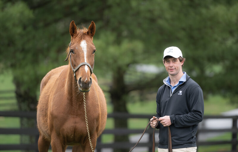 Headley VanMeter with a Thoroughbred horse.