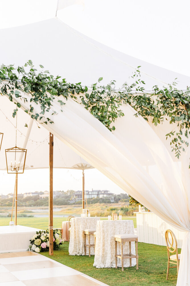 elegant tent with tables and chairs set up underneath