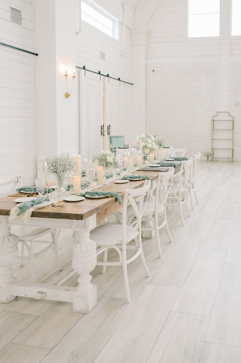 The Nest at Ruth Farms Wedding Venue | DFW Wedding Photographer Rae De Lain Light and Airy | Muted greens with hardwood table setting