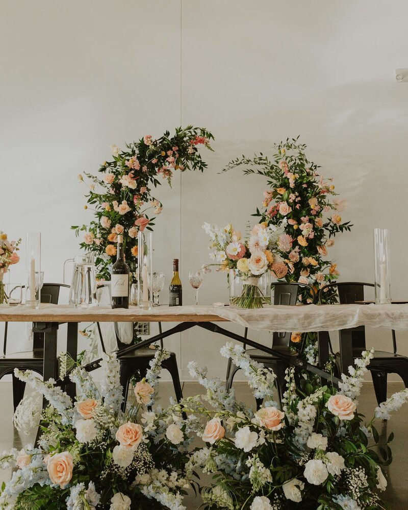 Elegant floral backdrop featuring white hydrangeas and orchids at August House wedding venue in Dickinson, North Dakota.