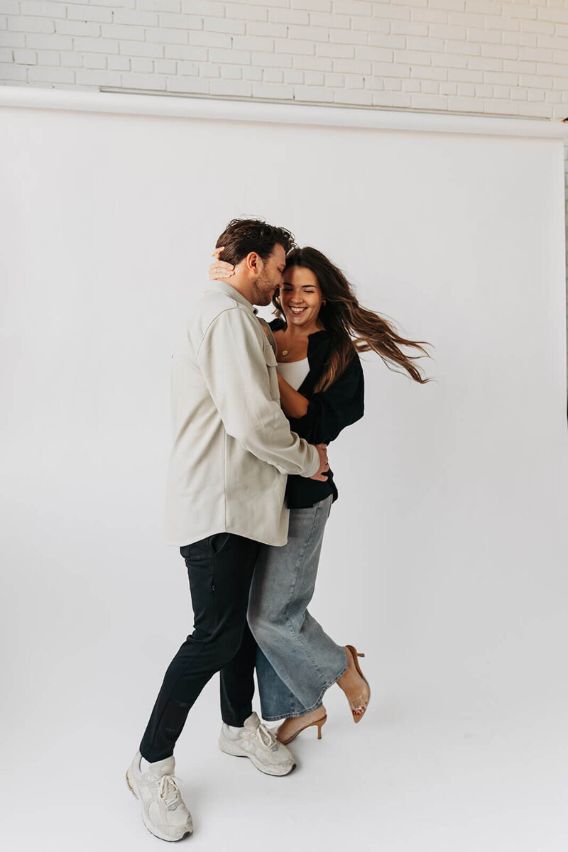 Minnesota wedding photographer and videographer dance around studio
