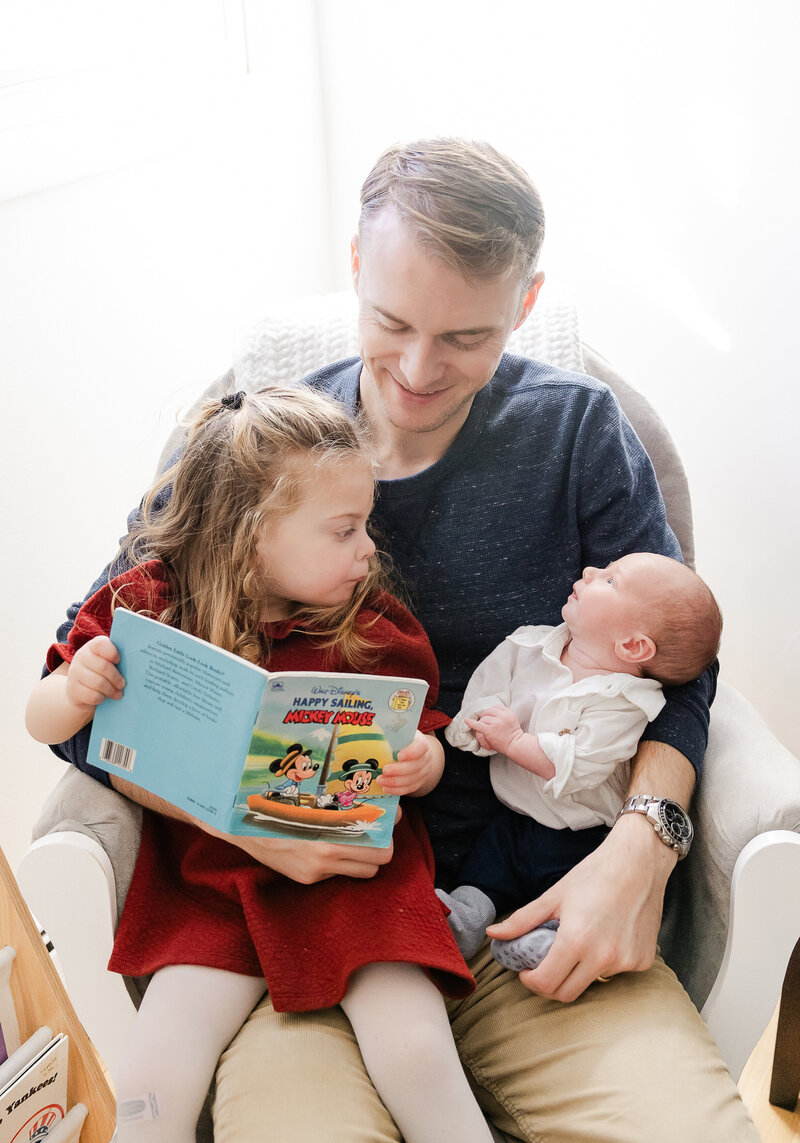 Lifestyle newborn photo session in NJ client's home, featuring big sister.