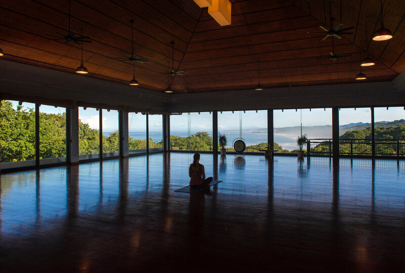 person sitting in sky mind hall yoga blue spirit costa rica