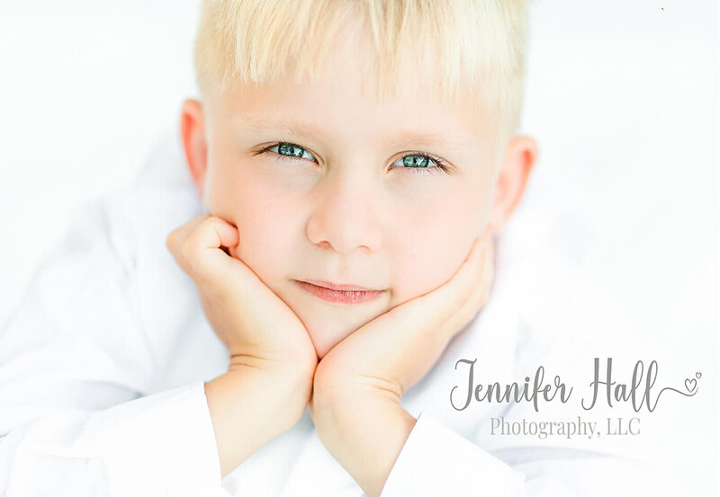 Boy with blonde hair and blue eyes at Jennifer Hall Photography, LLC.