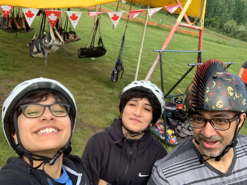 All suited up with helmets and straps for ziplining fun