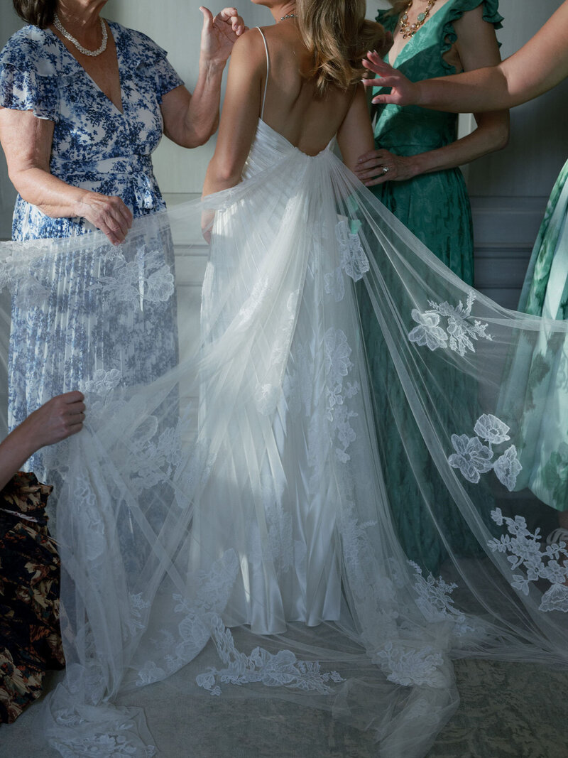 Detail photo of the bride’s train featuring floral embellishments