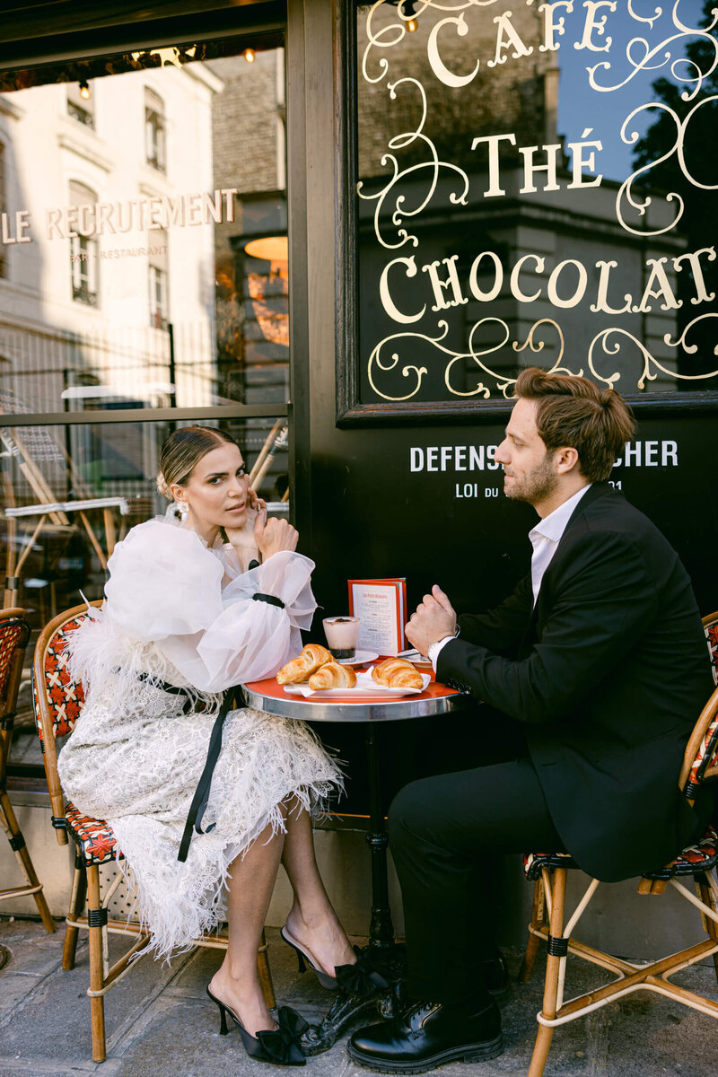 A wedding photo of the couple in the streets of Paris France