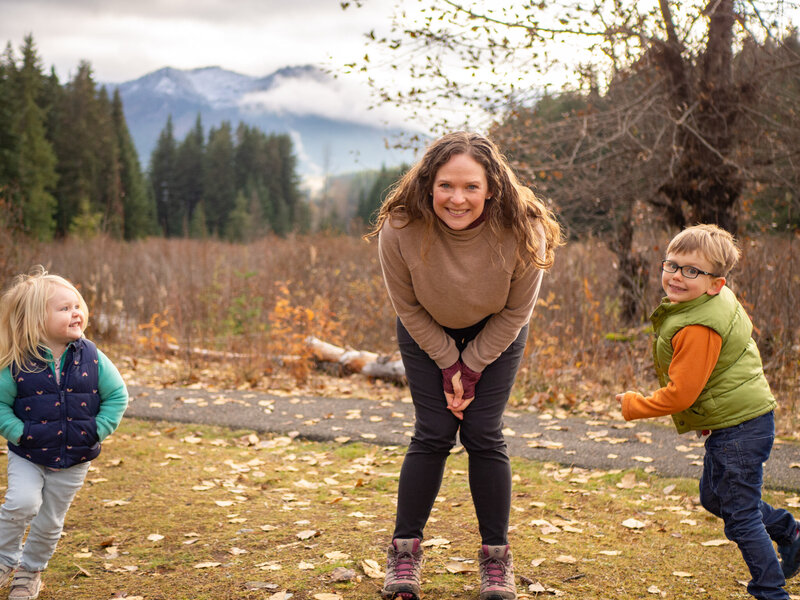 Becky is playing with her two kids demonstrating her approach to photography as a Seattle family photographer.