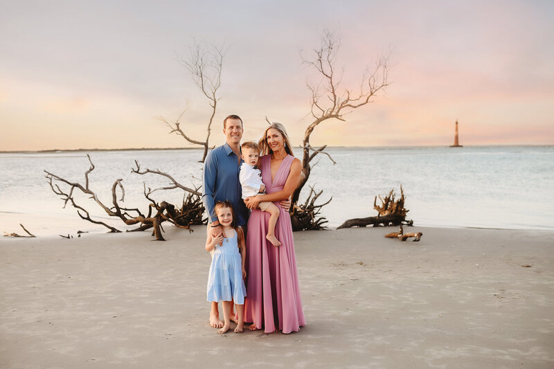 Family poses on the beach together during their Family Photoshoot on Folly Beach. 