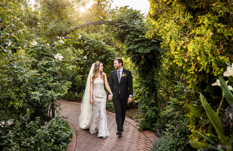 Couple walk along a path near the Romantic Gardens at Denver Botanic Gardens