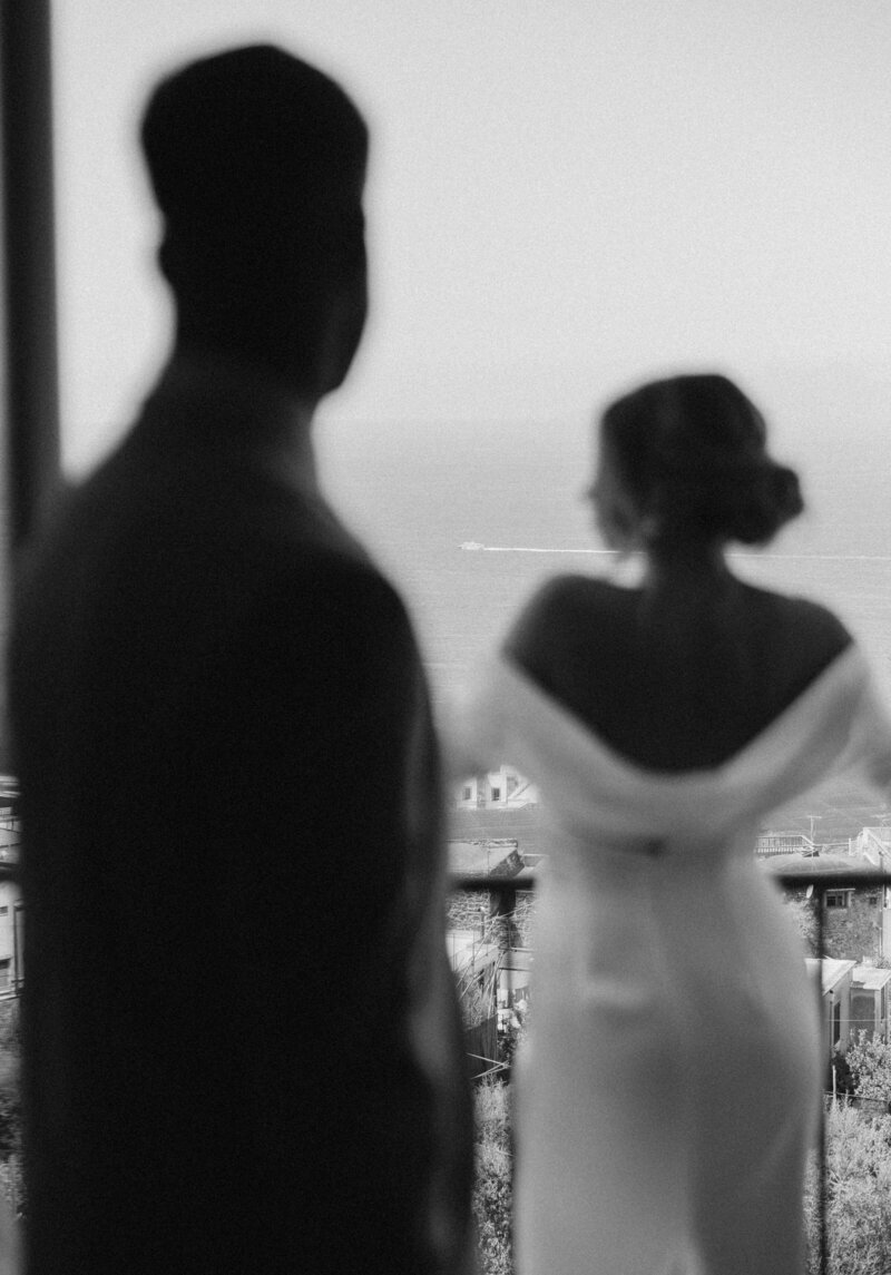 bride looking over her shoulder at groom