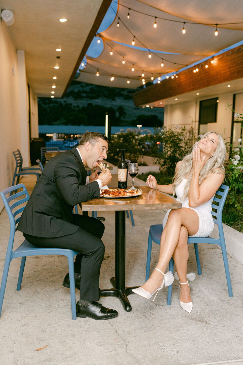 future bride and groom pose at the look out at sunrise at the griffith observatory in los angeles taken by los angeles wedding photographer magnolia west photography