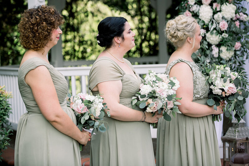 Sage green and white bouquets.