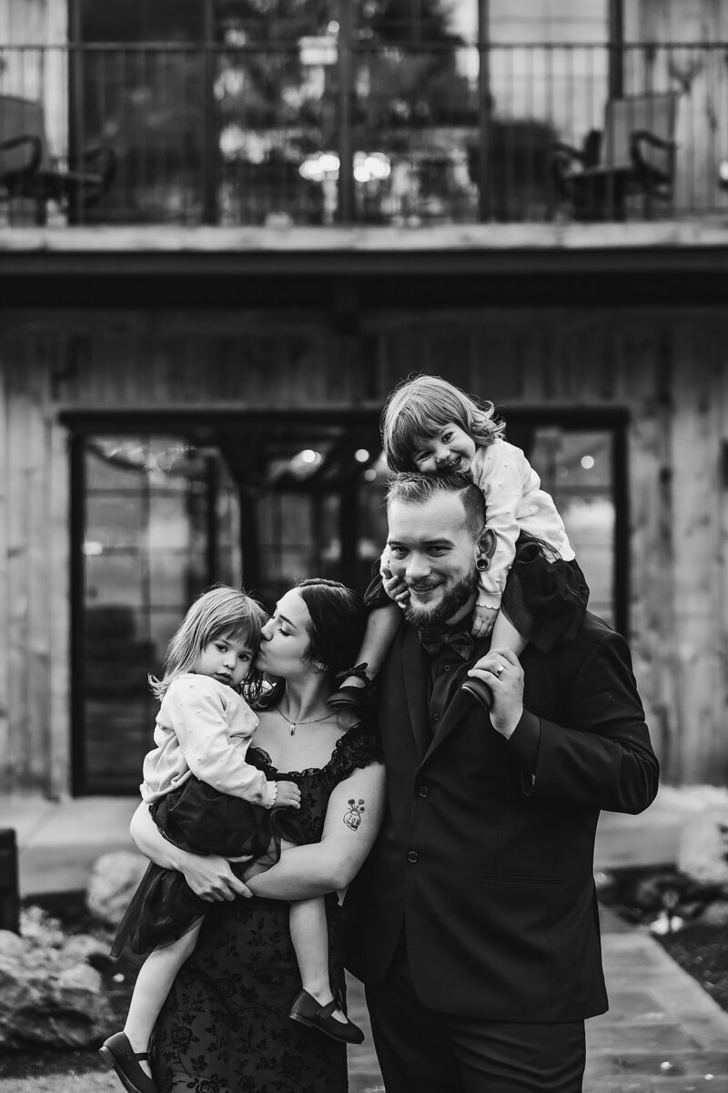 girl holding goldendoodle in the snow