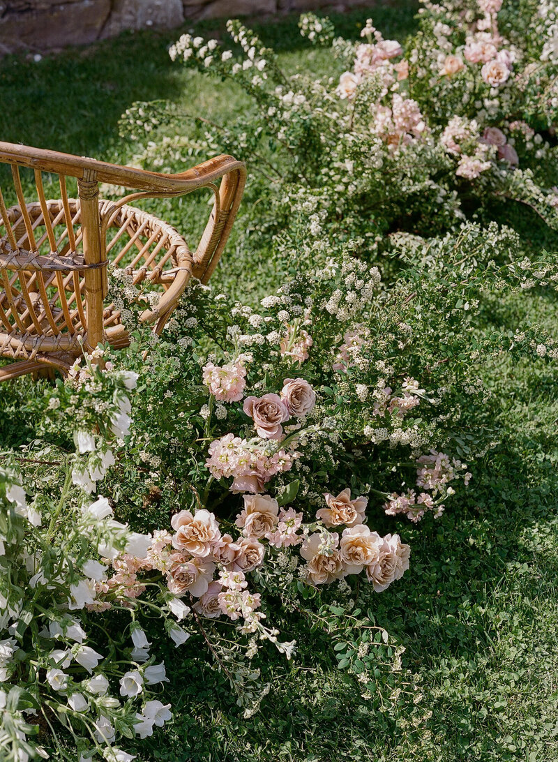 Pink and raspberry luxury Ginori china with yellow florals for a welcome dinner in Tuscany