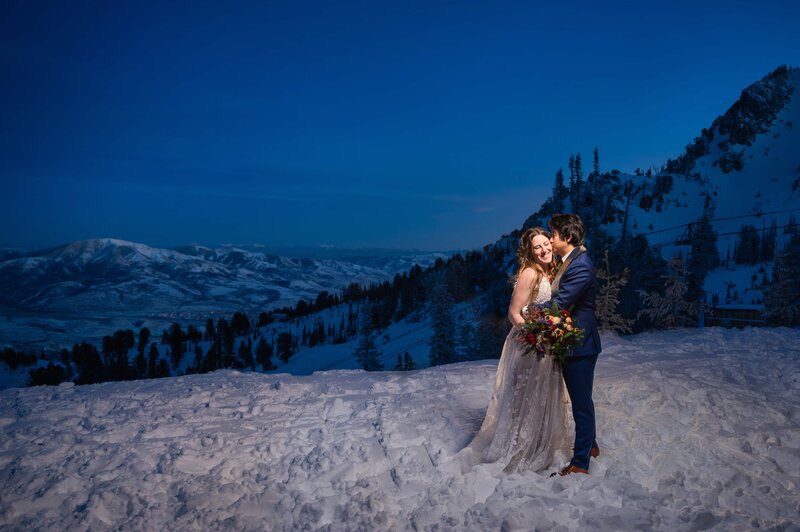 Bride and Groom at the top of Snowbasin Resort for their winter wedding
