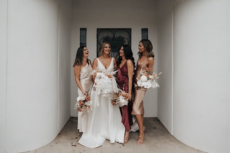 stunning bridesmaids having portraits at Pericoota Station wedding