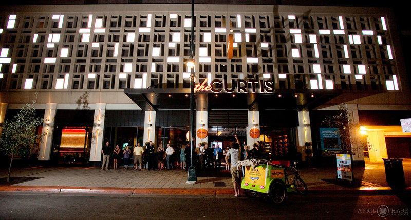 Exterior photo of the Curtis Hotel at Night in Downtown Denver Colorado