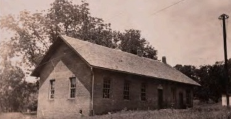 Historic photo of a brick schoolhouse in Fayetteville, Arkansas—an anchor of Black education and community legacy now being reclaimed through preservation efforts