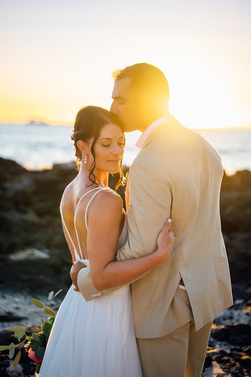 bride on black sand beach in hawaii