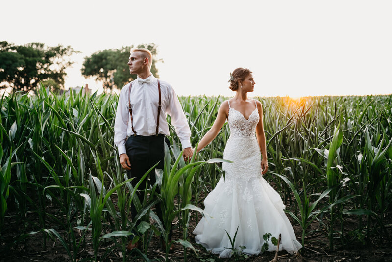 couple holding hands during golden hour as the sun is setting in Oregon Coast Elopement and Wedding Photographer