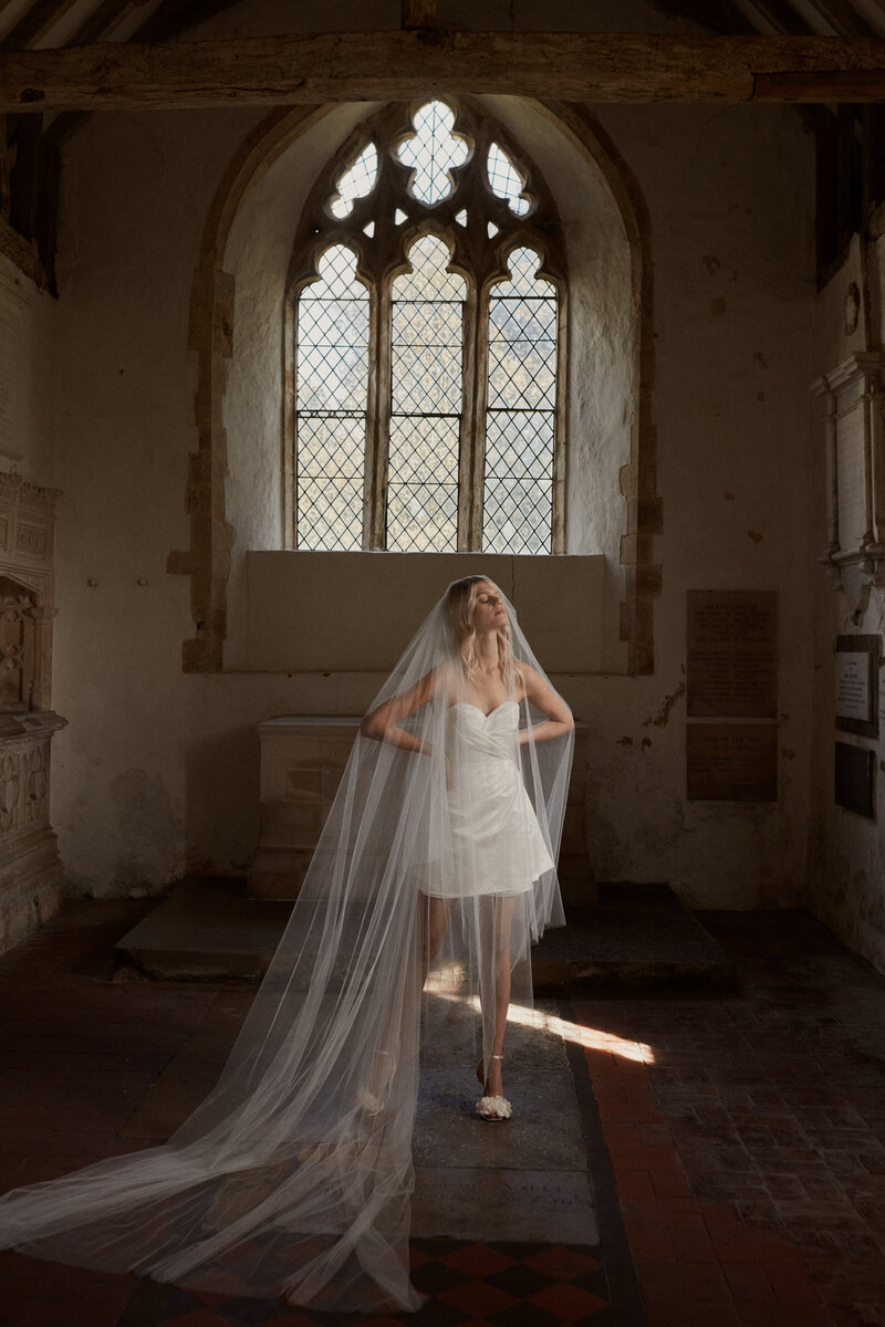 Bride wearing soft handmade silk mini corset wedding dress by British bridal designer Luna Bea