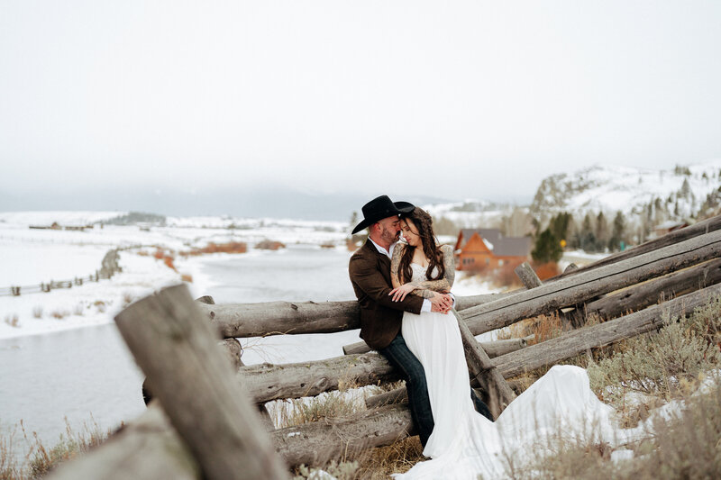 Bride and groom during elopement golden hour portrait session at Stanley, Idaho wedding - photographed by The Storytellers