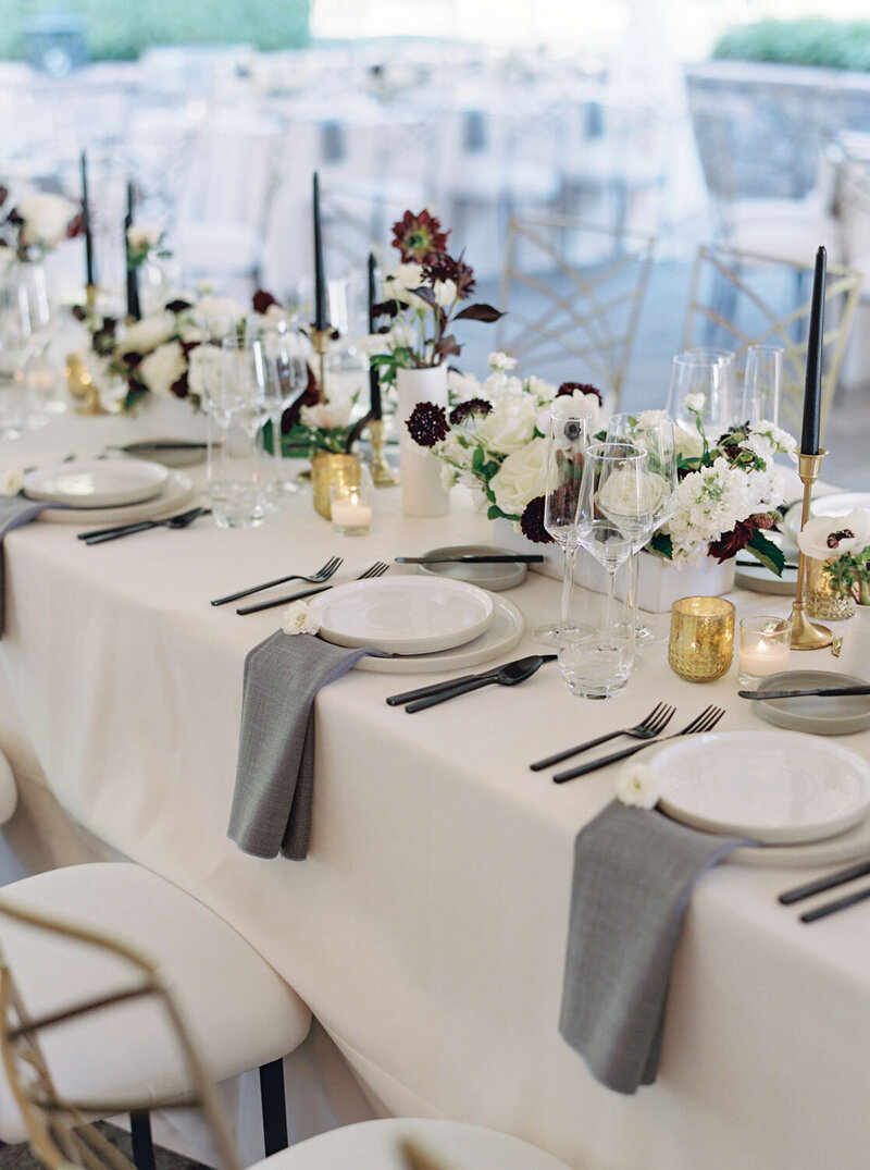 Minimalist tablescape with gold accents and white florals