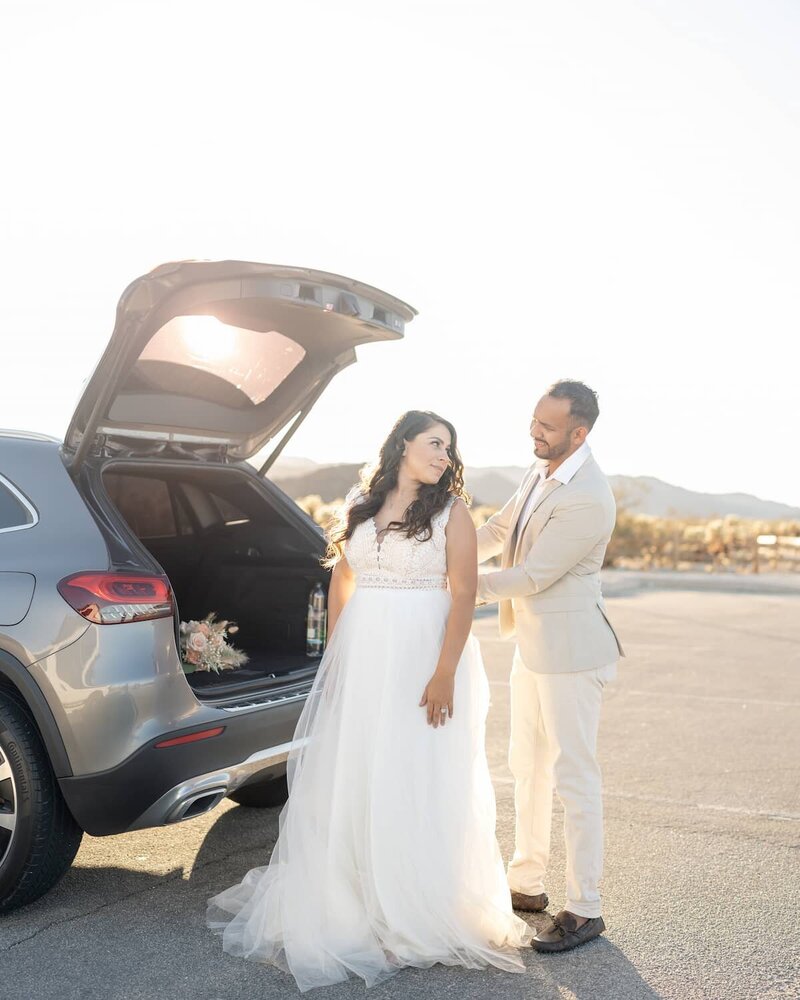 Joshua Tree elopement golden hour sunset getting ready photos at Cholla Cactus Garden with bride and groom.