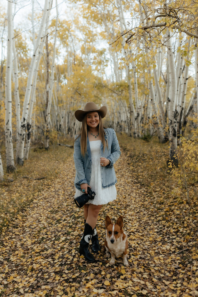 Studio portrait of a Wyoming-based wedding and lifestyle photographer, captured in a clean and professional setup with soft lighting and a relaxed pose.
