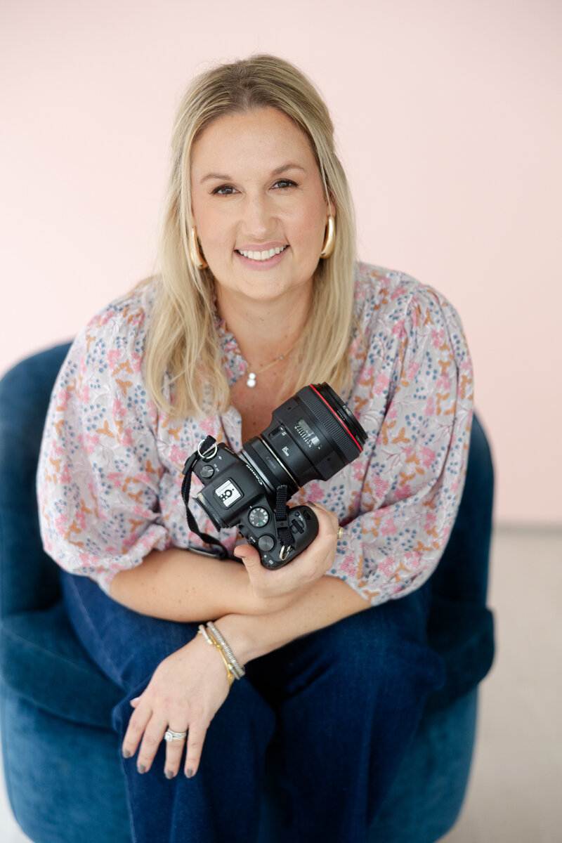 headshot of female photographer in a pink top