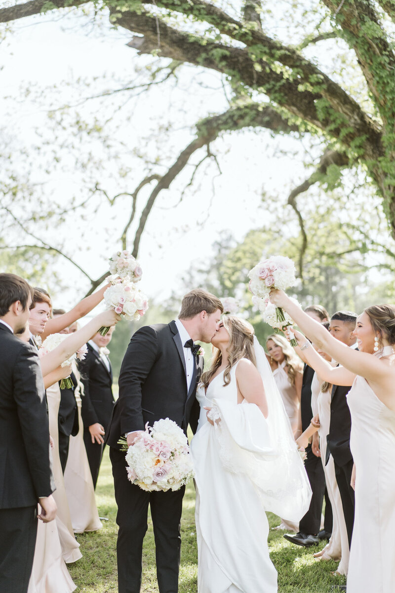a bride and groom sharing a kiss at Dodson Farms in Starkville, Mississippi