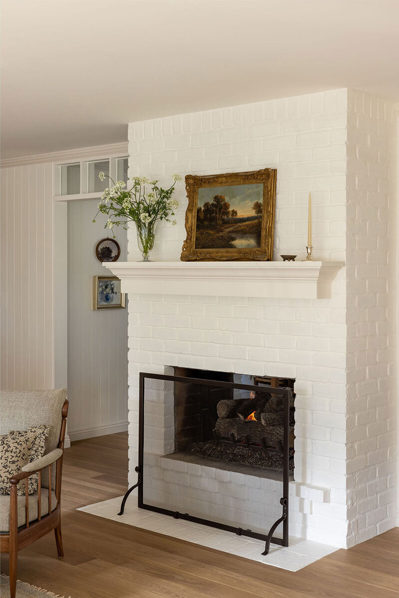 Traditional fireplace with natural stone and refined detailing
