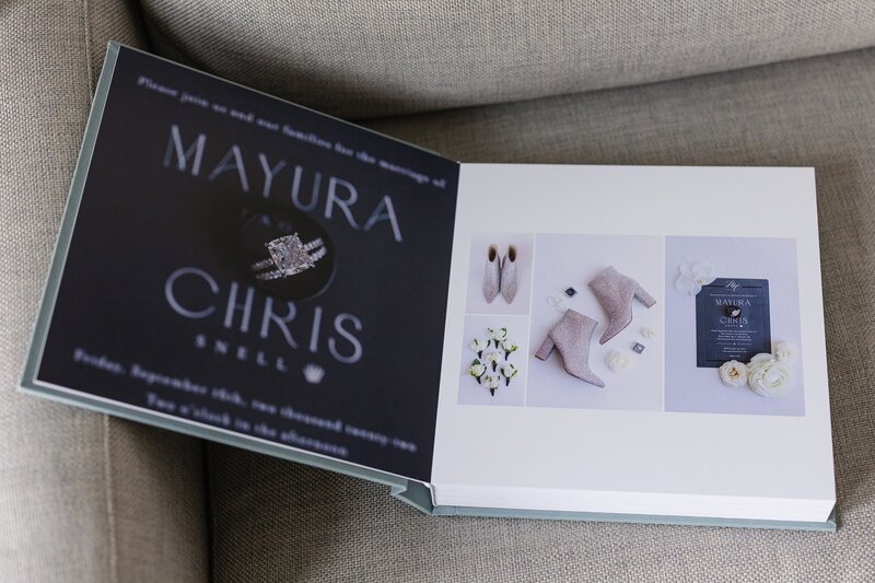 wedding album displays modern photos of dark wedding invitations and sparkly boots