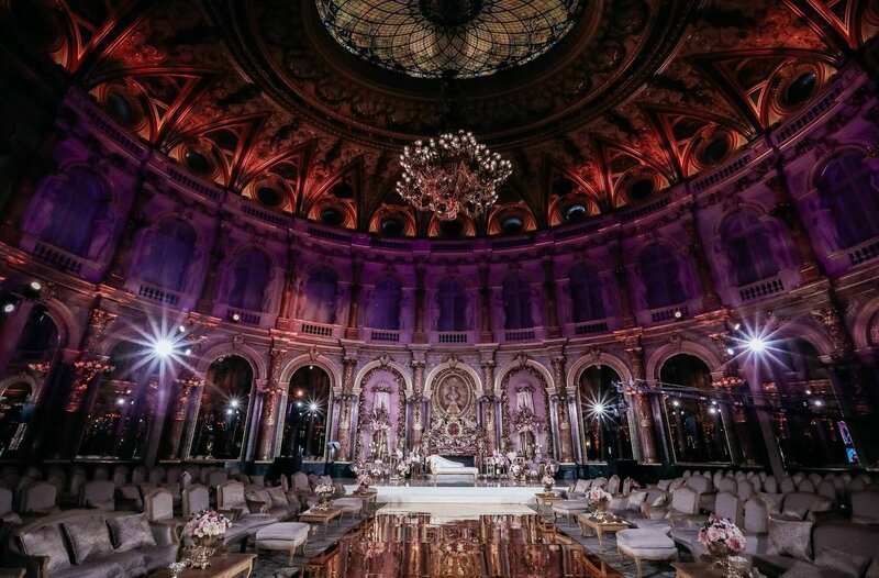 Large gilded room set up for wedding