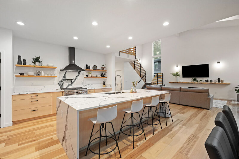 Modern kitchen with large island and sleek wooden cabinets