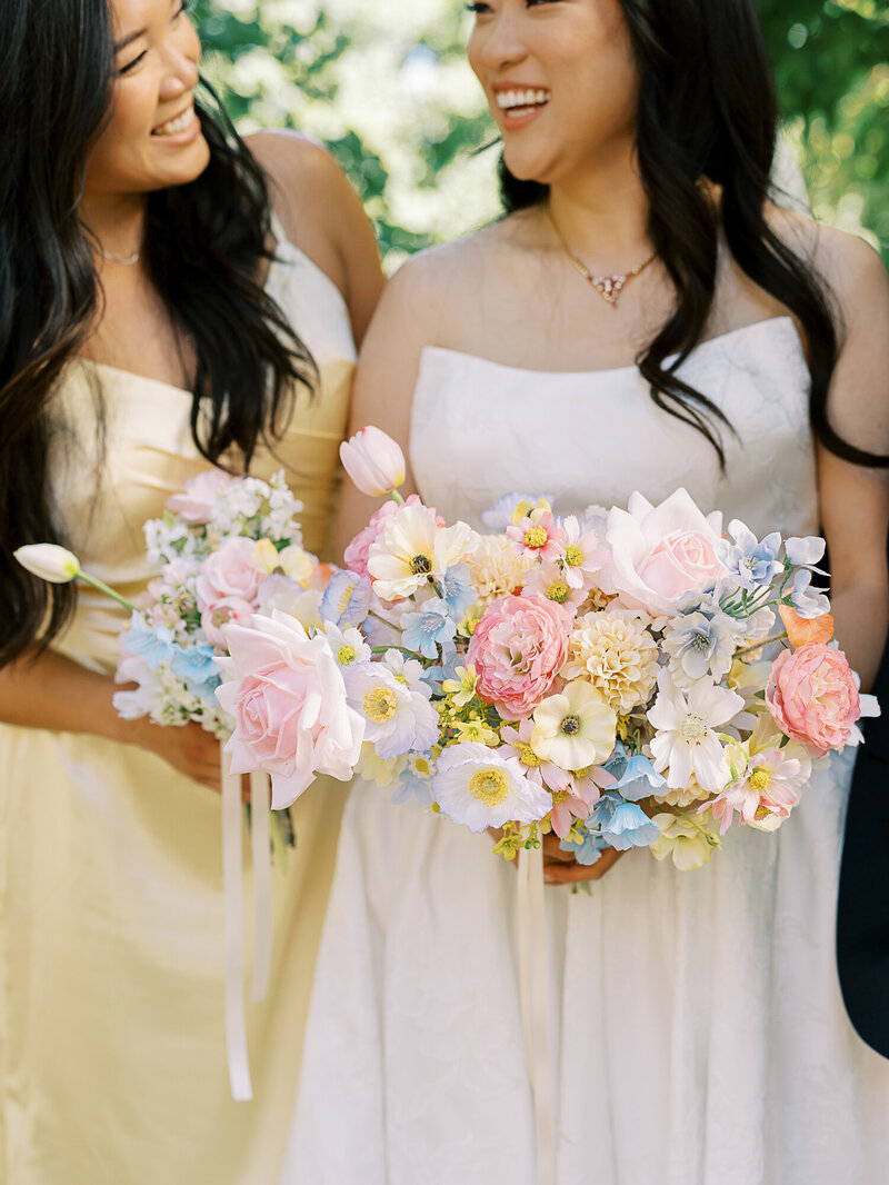 bride and bridesmaid with bouquet