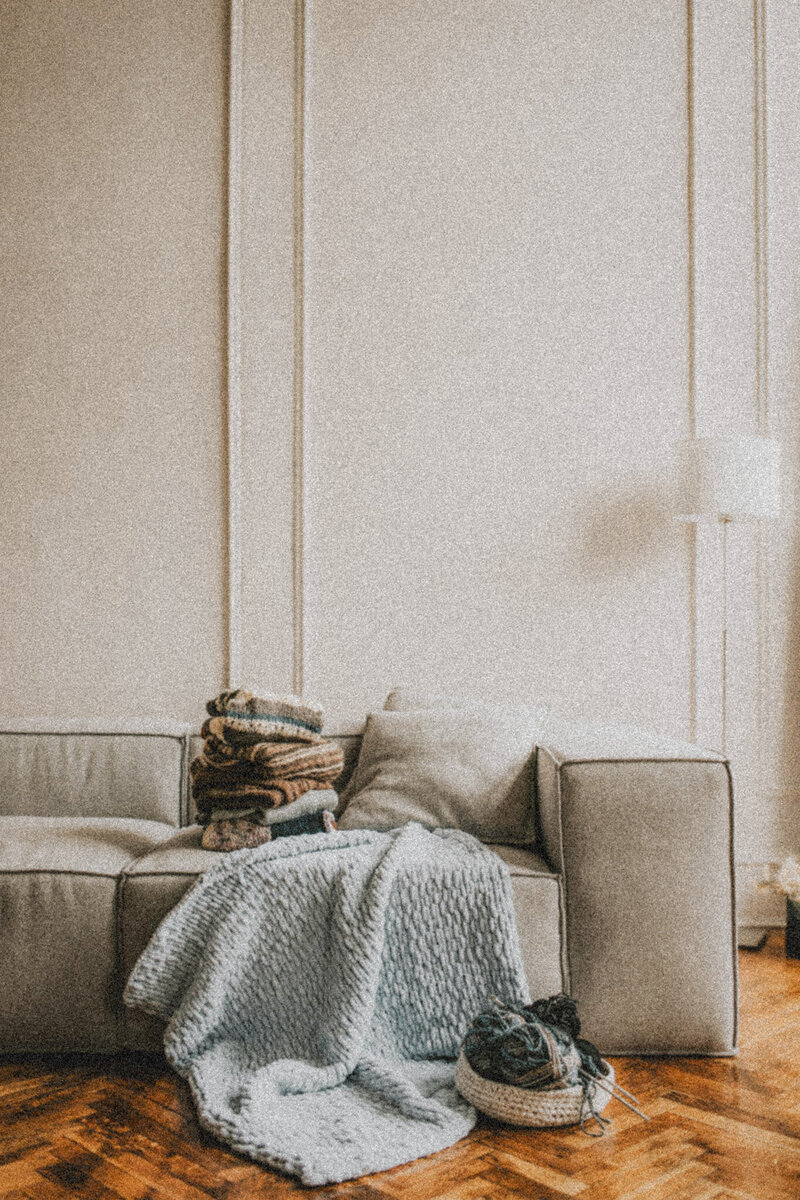 A warm and inviting sofa in a cozy therapy space, representing a safe and supportive environment for healing and growth.