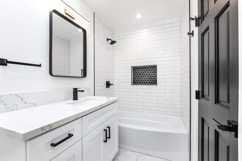 Black and white bathroom design. Full remodeling services, including demolition, design, and installation. 