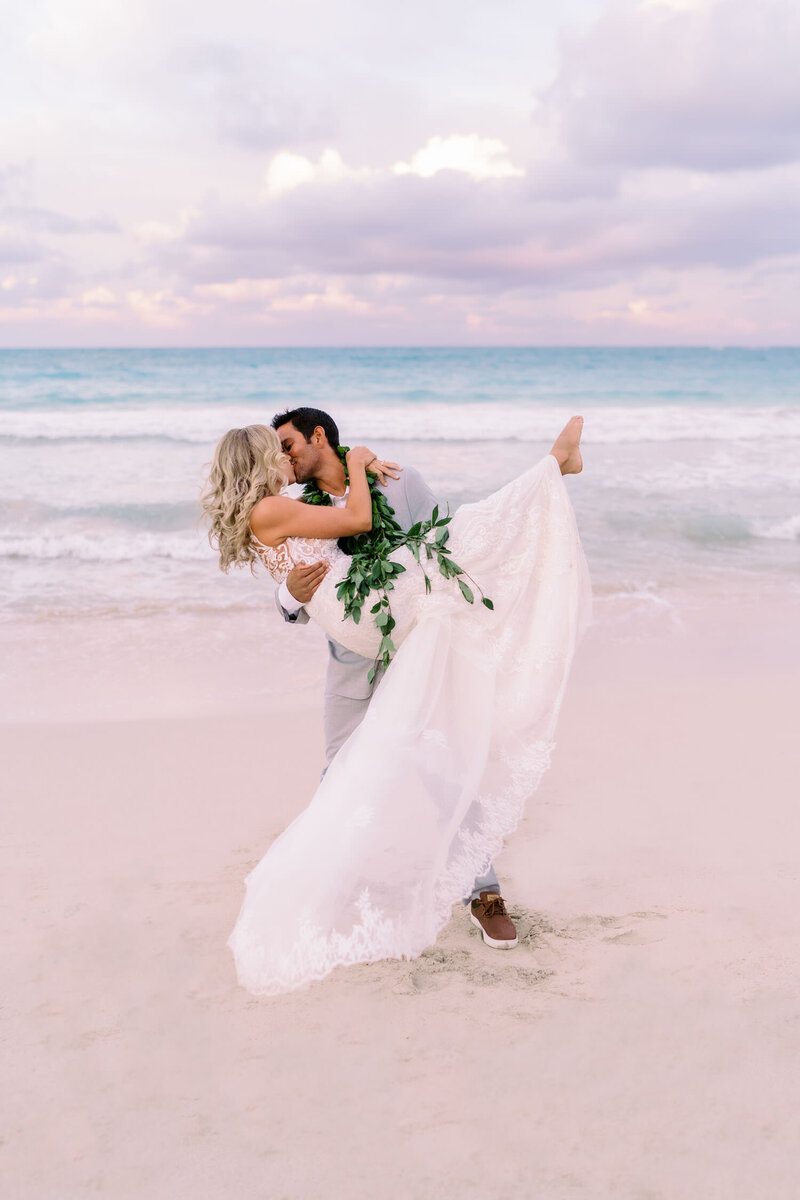Groom and Bride kissing on Kailua Beach