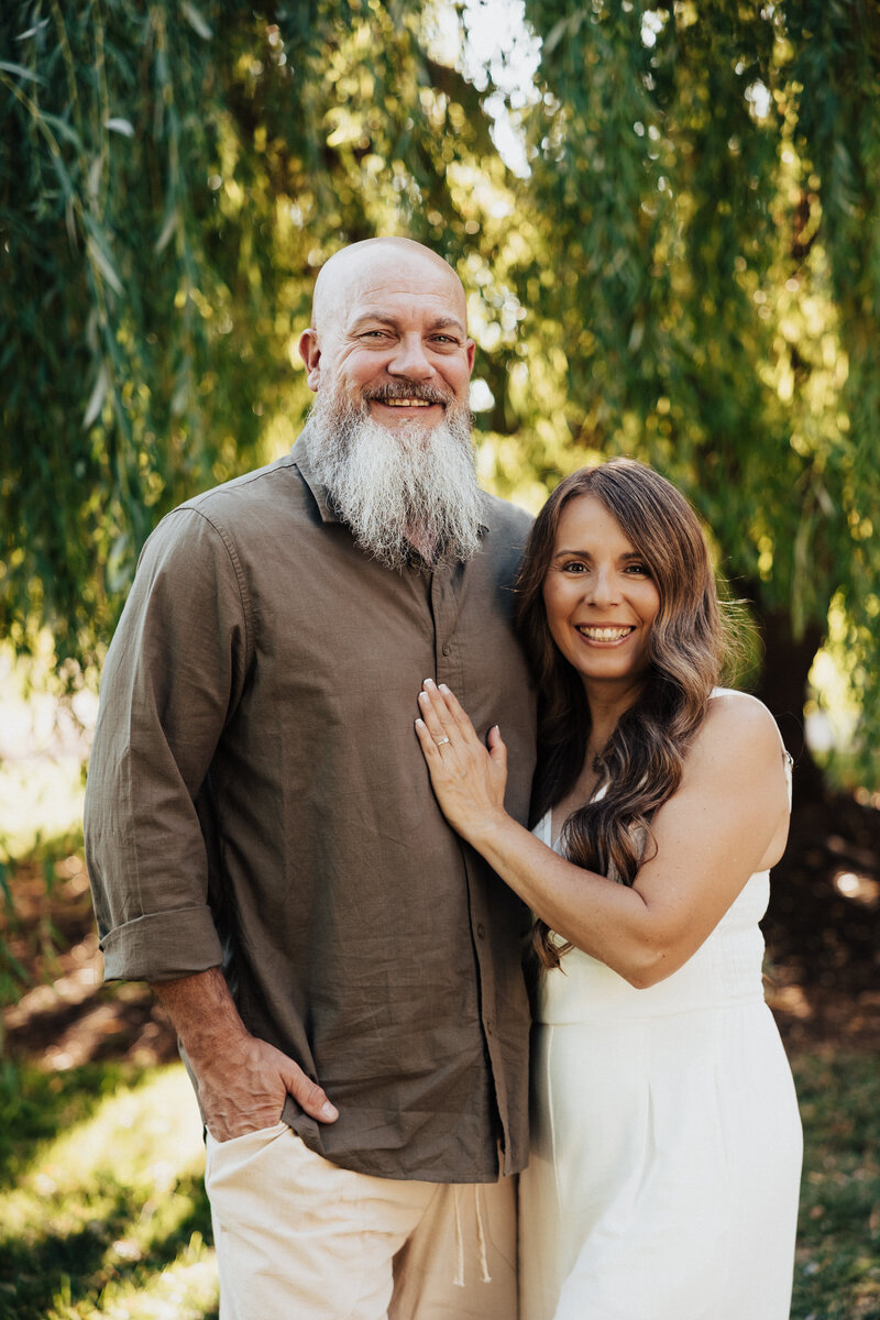 Patty and her husband Jason looking at the camera smiling